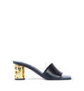 Tape heeled mules in leather