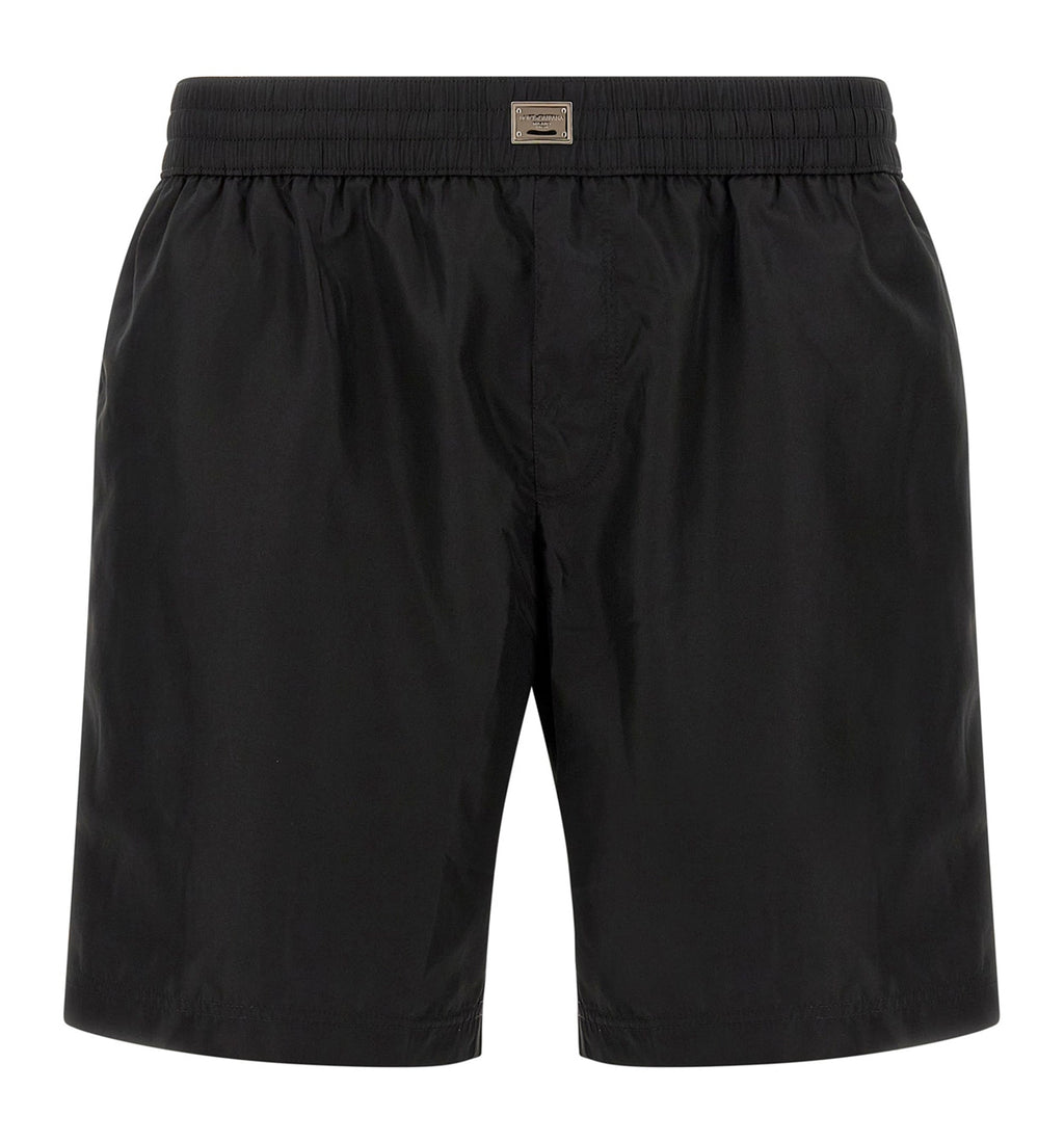 Mid-length swim trunks with tag