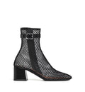 Fishnet 55 mesh and patent leather boots
