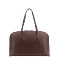 Suede handbag with engraved logo on the front