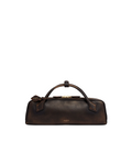 Le Teckel clutch in aged leather