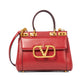 Small Rockstud Alcove Handbag In Grainy Calfskin - Red